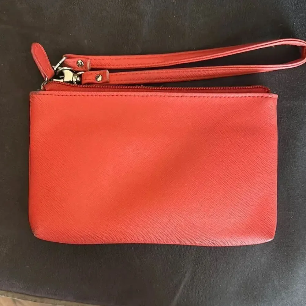 Nicole by Nicole Miller salmon colored Wristlet with Gold Details